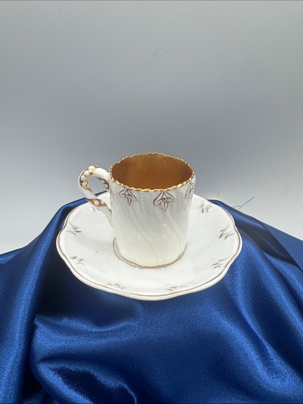 Vintage Coalport Demitasse Cup and Saucer. Gold and white decoration